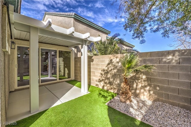 view of yard with a patio area and fence