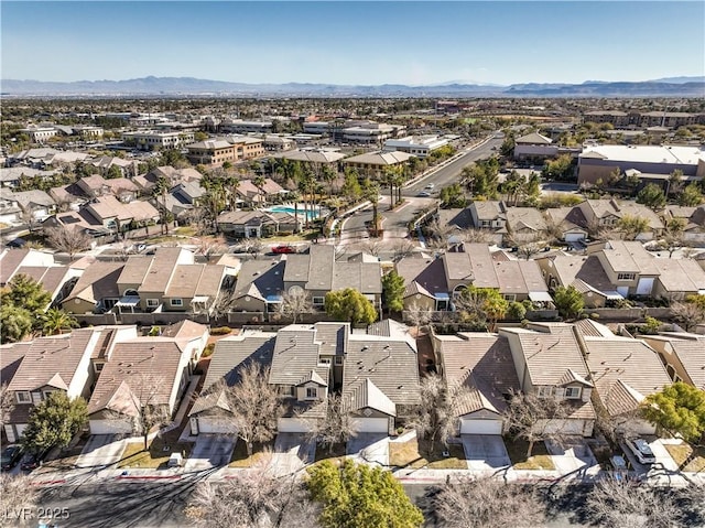 drone / aerial view with a residential view and a mountain view