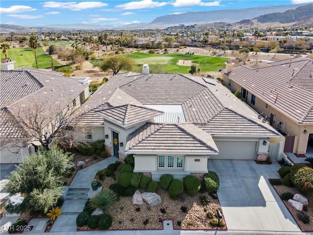 bird's eye view featuring view of golf course, a mountain view, and a residential view