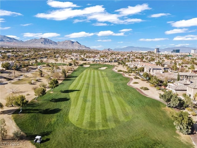 aerial view with a mountain view and golf course view