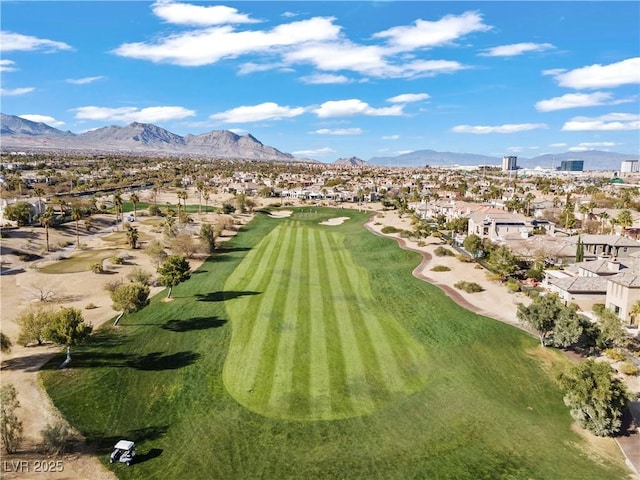 birds eye view of property featuring a residential view, view of golf course, and a mountain view