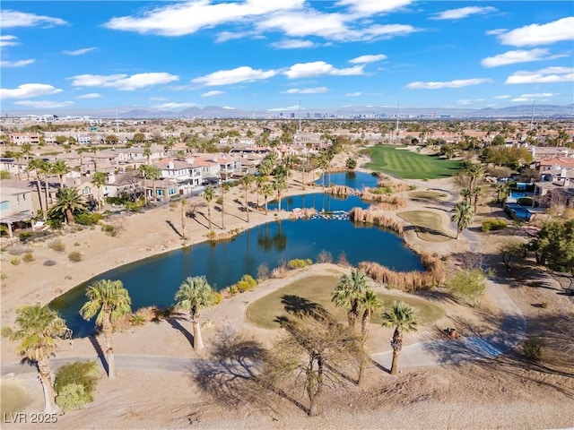 aerial view with a water and mountain view, golf course view, and a residential view