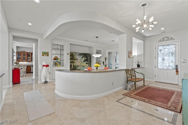 foyer entrance with an inviting chandelier, recessed lighting, and baseboards