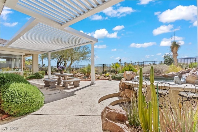 view of patio / terrace with fence and a pergola