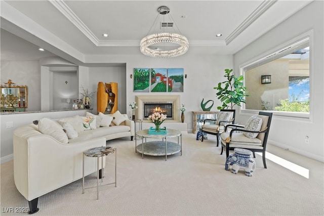 carpeted living room with visible vents, recessed lighting, a glass covered fireplace, and ornamental molding