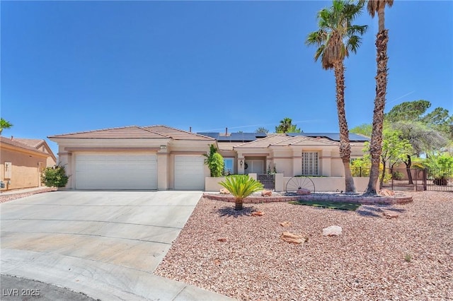 1596 Fieldbrook St, Henderson, NV 89052 - single story home featuring driveway, roof mounted solar panels, stucco siding, an attached garage, and a tile roof