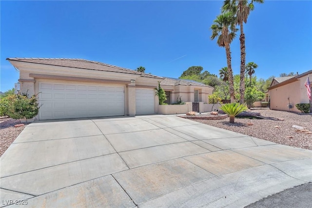 1596 Fieldbrook St, Henderson, NV 89052 - view of front of house with driveway, a garage, and a tiled roof