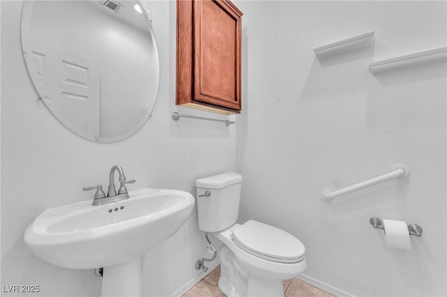 1596 Fieldbrook St, Henderson, NV 89052 - bathroom with toilet, a sink, tile patterned flooring, and baseboards