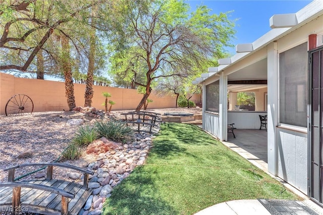 1596 Fieldbrook St, Henderson, NV 89052 - fenced backyard featuring a patio and an in-ground hot tub