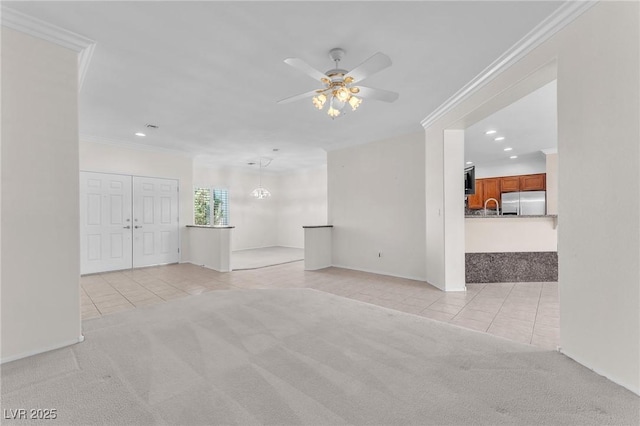1596 Fieldbrook St, Henderson, NV 89052 - spare room featuring light tile patterned floors, light colored carpet, recessed lighting, ceiling fan, and crown molding