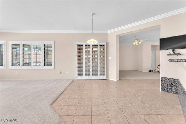 1596 Fieldbrook St, Henderson, NV 89052 - unfurnished dining area with light carpet, ornamental molding, baseboards, ceiling fan, and light tile patterned floors