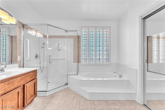 1596 Fieldbrook St, Henderson, NV 89052 - bathroom with vanity, a stall shower, a garden tub, and healthy amount of natural light