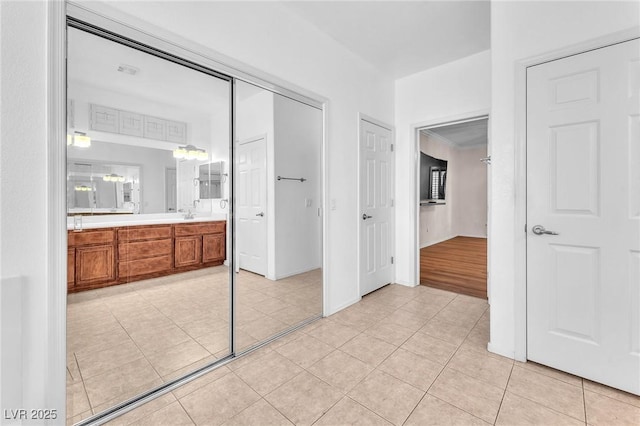 1596 Fieldbrook St, Henderson, NV 89052 - unfurnished bedroom featuring light tile patterned floors, a closet, and ensuite bath
