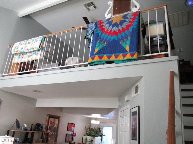 interior space with beam ceiling and visible vents