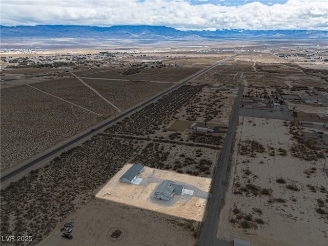 aerial view with view of desert and a mountain view