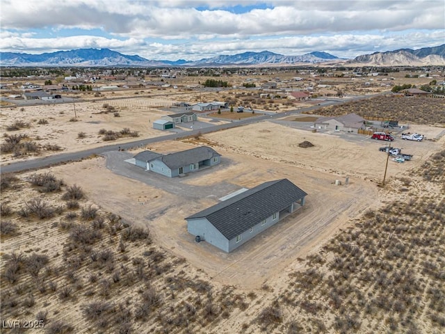 aerial view featuring view of desert and a mountain view