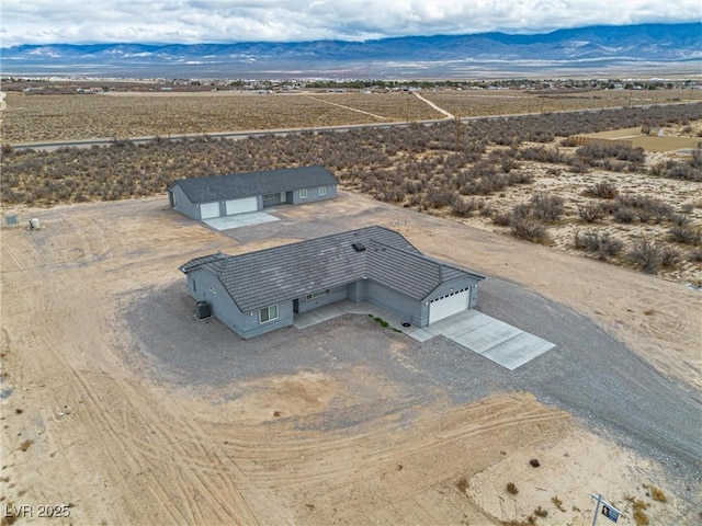 bird's eye view with a mountain view and a desert view