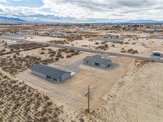 bird's eye view featuring a mountain view and a desert view