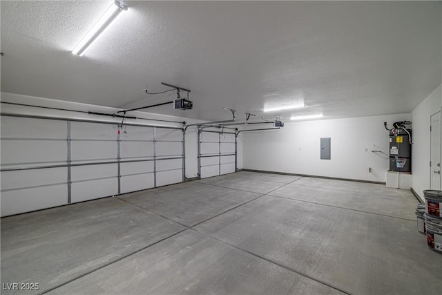 garage featuring electric panel, a garage door opener, and water heater