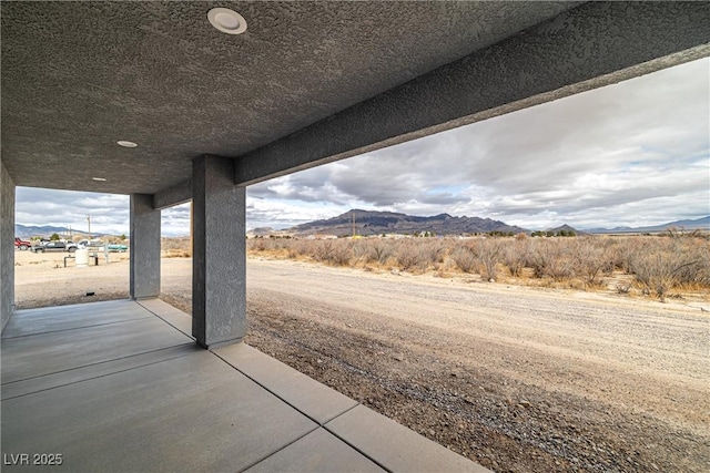 view of patio with a mountain view