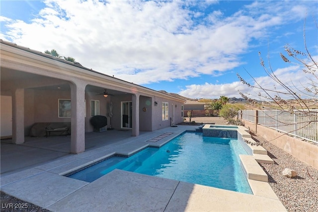 view of pool with a ceiling fan, a patio, a fenced backyard, and a pool with connected hot tub