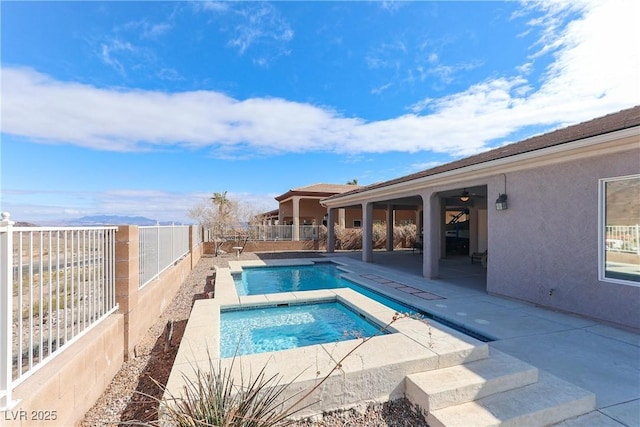 view of swimming pool featuring a fenced in pool, a patio, a fenced backyard, an in ground hot tub, and a ceiling fan