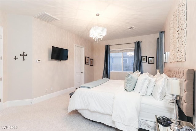 carpeted bedroom featuring visible vents, baseboards, and an inviting chandelier