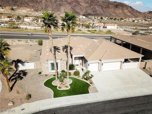 birds eye view of property with a mountain view