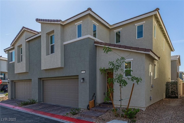 2901 Bahama Yellow Ave, North Las Vegas, NV 89086 - view of front of house with driveway, a tile roof, a garage, and stucco siding
