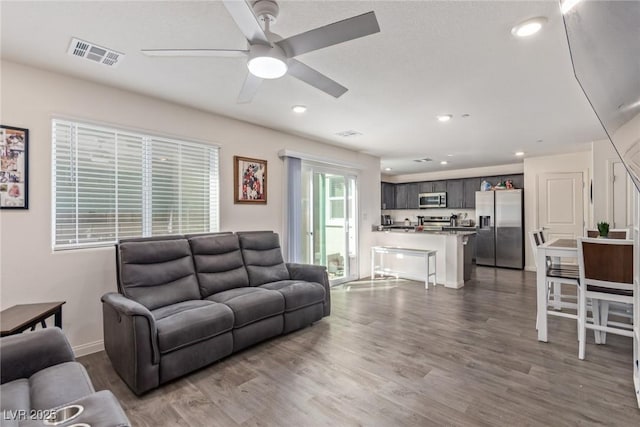2901 Bahama Yellow Ave, North Las Vegas, NV 89086 - living area with wood finished floors, ceiling fan, visible vents, and recessed lighting