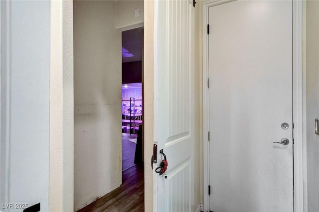 hallway featuring dark wood-style flooring