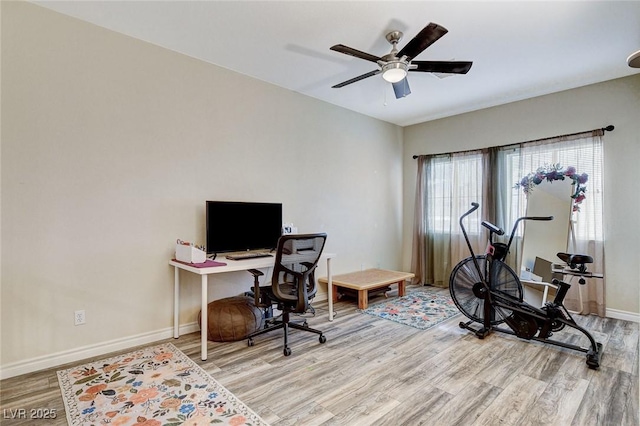 office space featuring ceiling fan, baseboards, and wood finished floors