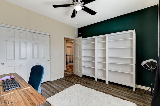 office area featuring a ceiling fan, wood finished floors, and baseboards