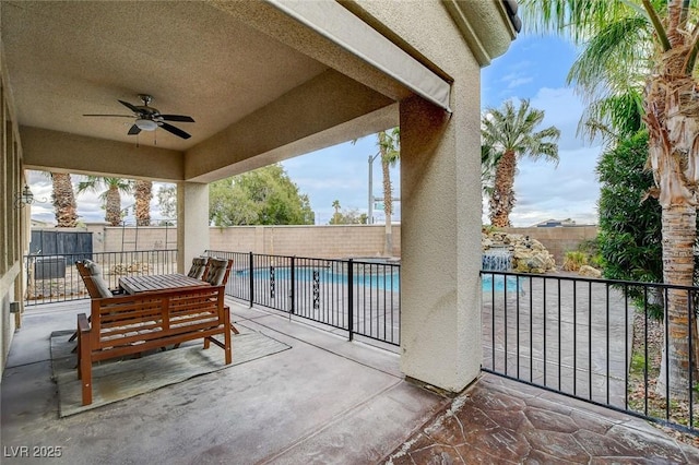 view of patio featuring a fenced backyard, a fenced in pool, and ceiling fan