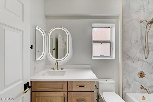 full bathroom with vanity, toilet, and bathtub / shower combination