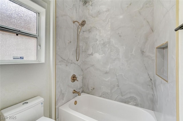 full bathroom featuring bathtub / shower combination and toilet