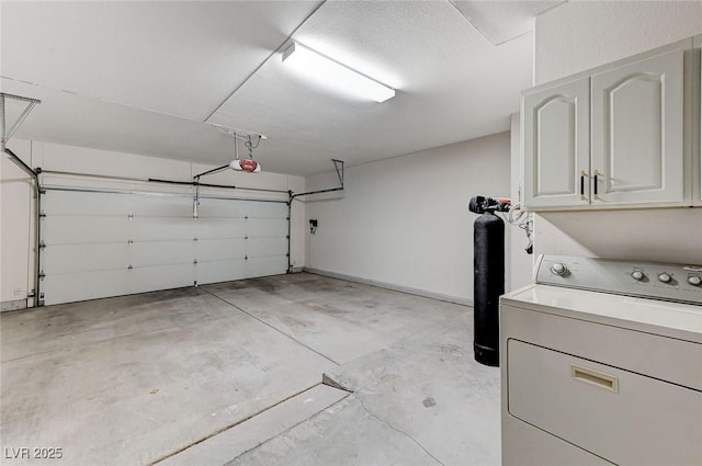 garage with washer / clothes dryer and a garage door opener