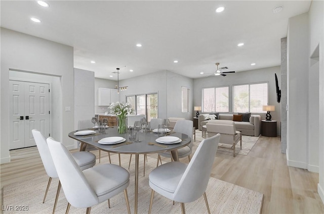 dining space with recessed lighting, a healthy amount of sunlight, and light wood-type flooring