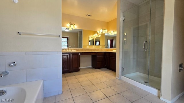 full bathroom featuring tile patterned flooring, visible vents, a shower stall, a tub, and vanity