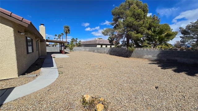 view of yard with a fenced backyard