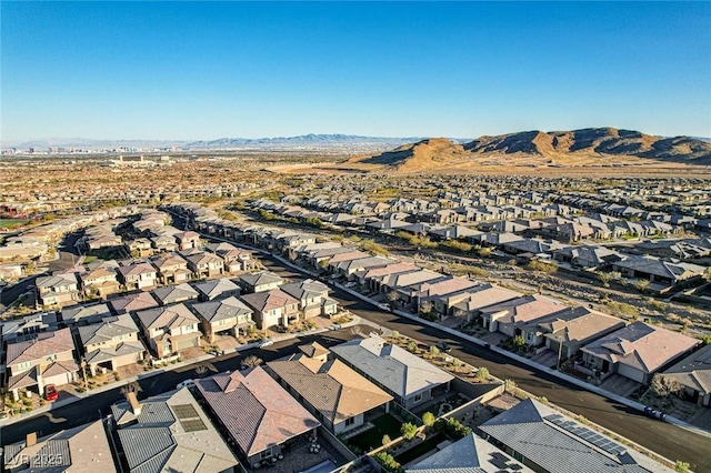 birds eye view of property with a mountain view and a residential view