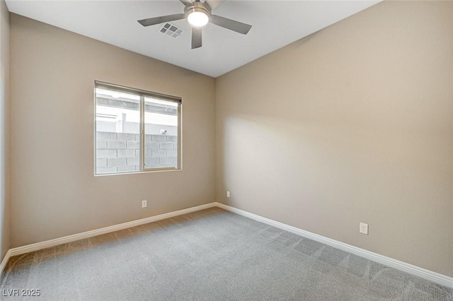 unfurnished room featuring visible vents, carpet floors, baseboards, and ceiling fan