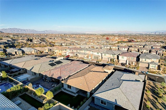 aerial view featuring a mountain view and a residential view