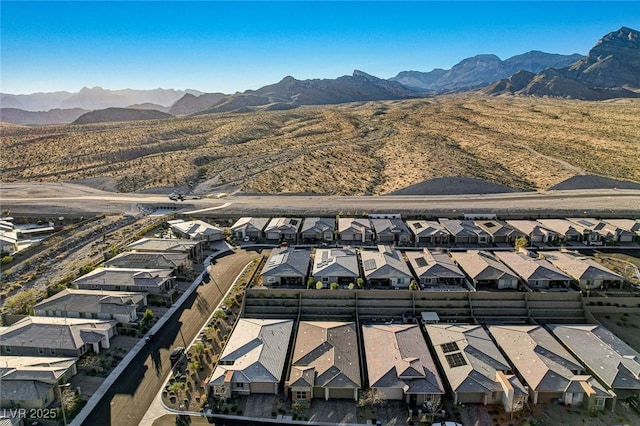 drone / aerial view with a residential view and a mountain view