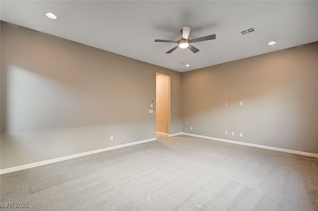 unfurnished room with carpet, recessed lighting, baseboards, and visible vents