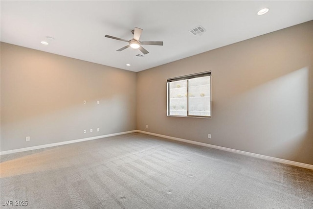 carpeted spare room featuring visible vents, recessed lighting, a ceiling fan, and baseboards