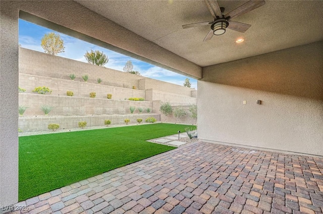 view of patio / terrace with ceiling fan and a fenced backyard