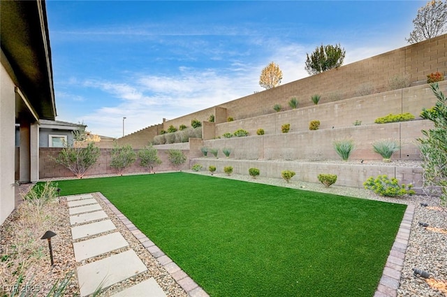 view of yard featuring a fenced backyard