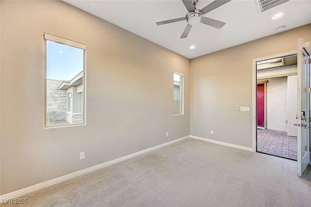 carpeted spare room with visible vents, recessed lighting, baseboards, and ceiling fan