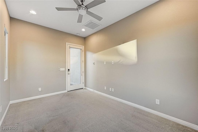 carpeted empty room featuring recessed lighting, baseboards, visible vents, and ceiling fan